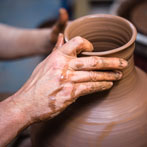 Doug Fitch and Hannah McAndrew making a jug for me